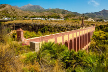 A View Along The Top Storey Of The Majestic, Four Storey, Eagle Aqueduct That Spans The Ravine Of Cazadores Near Nerja, Spain In The Summertime