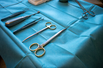 in operating room there is an instrument table with surgical instruments