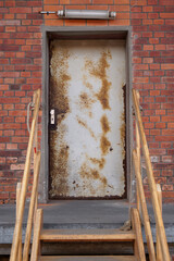 Wall Mural - Vertical shot of rusty iron door