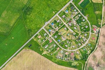 Wall Mural - planned residential community in countryside. rural summer landscape, aerial top view