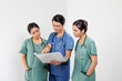 Young Asian male female doctor wearing apron uniform tunic stethoscope holding laptop talk discuss