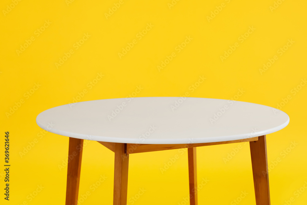 Dining table on color background