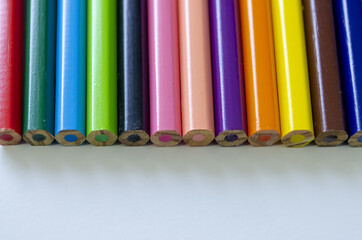 Poster - Closeup shot of the colorful pencils on the white surface