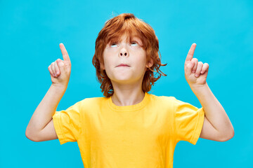 Sticker -  child with red hair points up with index finger Copy Space