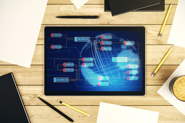 Top view of modern digital tablet monitor with abstract programming language hologram and world map, artificial intelligence and neural networks concept. 3D Rendering