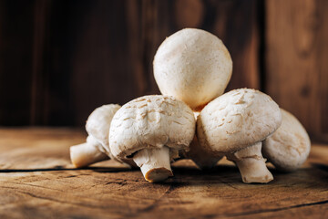 Mushrooms on a wooden background close up