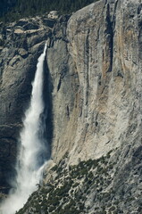 Yosemite waterfalls plum and mountain side detail, nature is colorful, alive and inspiring. travel destination in California  for adventure, action, serenity. 