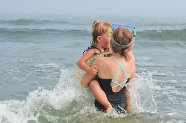 Caucasian children outdoor in summer lifestyle on the beach