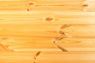 Natural wood texture for background. Pine tree timber. Horizontal boards. Wooden board of natural color (pine) with texture and knots.