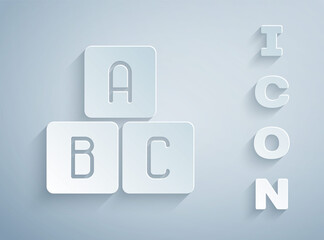 Sticker - Paper cut ABC blocks icon isolated on grey background. Alphabet cubes with letters A,B,C. Paper art style. Vector Illustration.