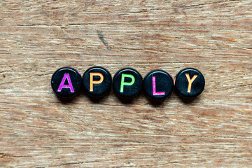 Canvas Print - Black bead with color letter in word apply on wood background