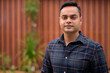 © Ranta Images - Portrait of young handsome Indian businessman outdoors