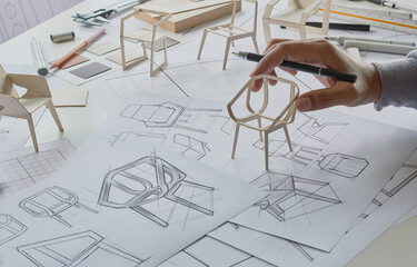 Designer sketching drawing design development product plan draft chair armchair Wingback Interior furniture prototype manufacturing production. designer studio concept .