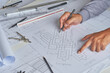 © Chaosamran_Studio - Architect engineer contractor design working drawing sketch plan blueprint and making architectural construction house building in architect studio.