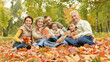 © aletia2011 - Portrait of family relaxing in autumn park