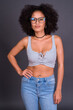 © Ranta Images - Young beautiful African woman with Afro hair wearing eyeglasses