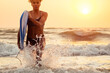 © yurakrasil - afro american woman run with surfboard on beach in Goa