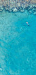 © Valentinos Loucaides - An aerial view of the beautiful Mediterranean Sea and a swimmer, where you can see   the cracked rocky textured underwater corals and the clean turquoise water of Protaras, Cyprus,