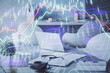 © peshkova - Double exposure of stock market graph drawing and office interior background. Concept of financial analysis.