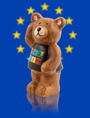 Wall Mural - The bear is the symbol of the city of Berlin. Bear on the background of the flag of Europe.