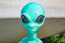 Turquoise Plastic Toy Alien With Big Black Eyes