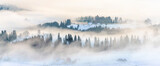 Fototapeta Desenie - Winter landscape with mist on mountain hills panoramic view, banner