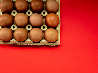 Wall Mural - Eggs in a yellow cardboard egg cup