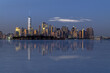 © blanchardimage - Reflections of New York city skyline at sunset
