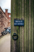 Private No Entry Sign At The Door With A Classic Handle.