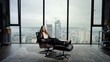 © stockbusters - Businesswoman relaxing on chair in modern interior. Serious manager looking away