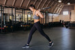 © Leah Flores/Stocksy - Woman Doing Lunges with Barbell in Gym