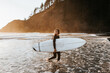 © Caleb Gaskins/Stocksy - Girl with surfboard