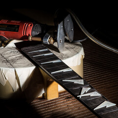 Classical guitar under construction in luthier workshop