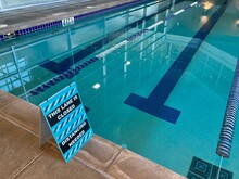 Swimming Pool With Social Distancing Sign
