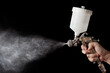 © Luciano Queiroz - Close up of a spray paint gun with black background