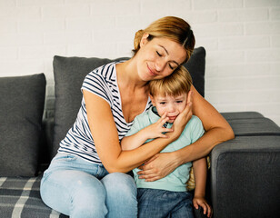 child mother boy son family woman crying parent sad love kid childhood care calming down comfort