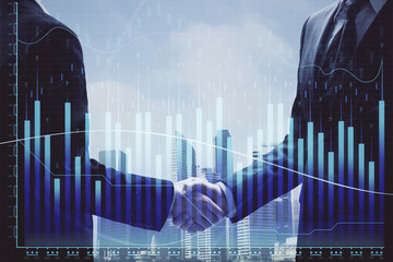 Double exposure of forex graph hologram and handshake of two men. Stock market concept.