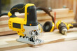 Power tool .Electric jig saw machine on Walnut Plywood in workshop, woodworking Handicraft and diy concept .selective focus