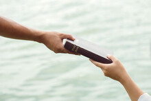 Man Hand Giving The Bible To Women.Concept Of Giving