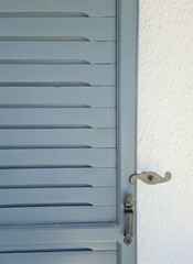 Wall Mural - Blue traditional wooden Greek islands door on a wall