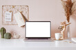 © uv_group - Laptop with blank white screen on office desk interior. Stylish gold workplace mockup table view.
