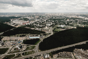 Top view aerial photo from flying drone of a Global City with development buildings, transportation, energy power infrastructure. Financial and business centers in Minsk, Belarus
