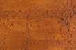 Traditional moroccan terracotta colored background. Orange or ocher clay wall texture. Painted shabby concrete.