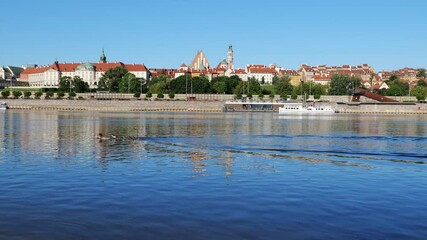 Canvas Print - City skyline of Warsaw in Poland, duck with ducklings on Vistula river with Old Town in the background.