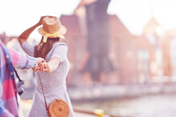 Wall Mural - Adult happy tourists sightseeing Gdansk Poland in summer