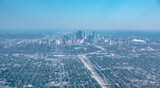 Fototapeta Miasto - above the clouds and above minneapolis minnesota from airplane