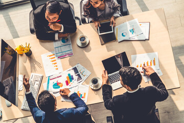 Wall Mural - Business people group meeting shot from top view in office . Profession businesswomen, businessmen and office workers working in team conference with project planning document on meeting table .