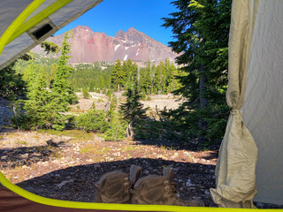 Wall Mural - a large volcanic mountain peak is framed by the entryway of a small backpacking tent.