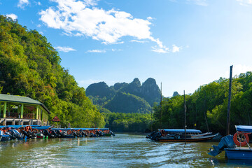 Asian boat station for small tourist boats. Boat excursions on the river.