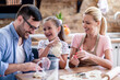 © ivanko80 - Family making cookies at home in the kitchen.